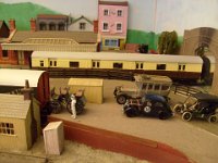 S6300109  The train for The Historic Vehicles Rally is loading - the Stig dresses up to load a '93 Benz, a 1934 Simca rally car, 1912 RR and an early Ford T wait their turns.  Llithfaen platform  has a Newspaper van unloading.