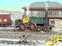 B3  Gooch broad-gauge 4-4-0T “Corsair” waits the road at the signal box.  Note the realistic stonework.