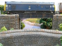 P1180817  Class 25 number 25 168 crossing the bridge over the River Clwyd with an oil train. Note how the backscene with its soft focus and diffused light effect, makes a more complete picture.